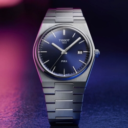 Reloj Tissot PRX de hombre en acero y esfera azul, T1374101104100.